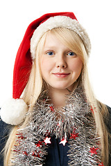 Image showing A beautiful young blonde in a Santa hat
