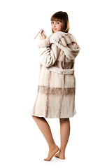 Image showing A beautiful young girl in a fur coat