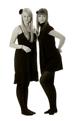 Image showing Two girls in black dresses (black and white)