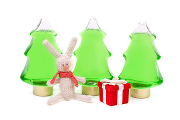 Image showing Knitted rabbit and a red box gifts