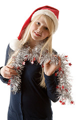 Image showing A beautiful young blonde in a Santa hat