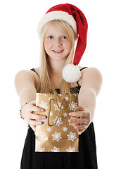 Image showing Young beautiful girl in a Santa hat