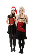 Image showing Two girls in the Santa hat