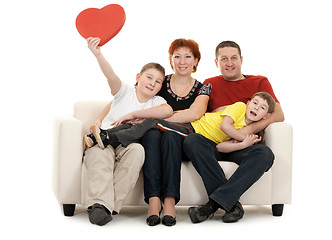 Image showing Family of four on a sofa