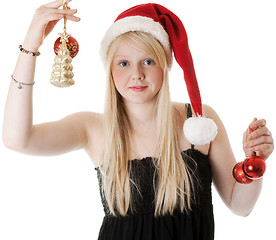 Image showing Young beautiful girl in a Santa hat