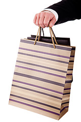 Image showing detail of a hand of a man doing shopping,with bags 