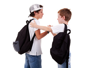 Image showing boys going to school, greeting one another, seen from the back