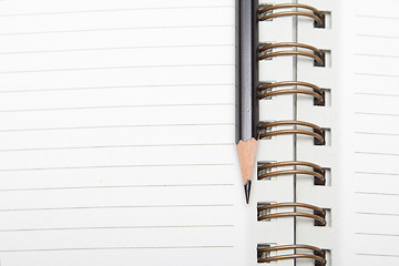 Image showing A diary and a pencil