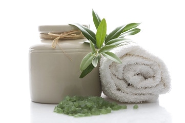 Image showing fresh olive branch and bath salt. spa