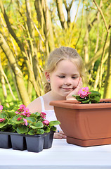 Image showing Little girl - gardening