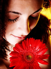 Image showing Girl with a red flower