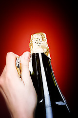 Image showing Opening champagne bottle