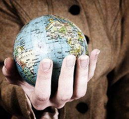 Image showing Globe in a girl's hands