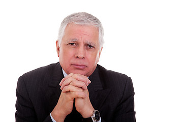 Image showing Portrait of a handsome mature businessman, thinking with hands crossed