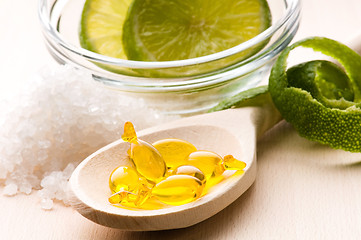 Image showing lemon bath - bath salt, capsule and fresh fruits