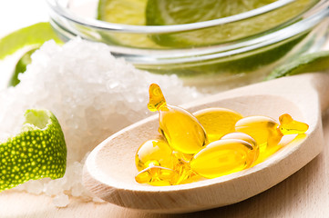 Image showing lemon bath - bath salt, capsule and fresh fruits