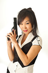 Image showing The Asian girl with a handgun