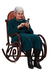 Image showing Old woman with mobile phone