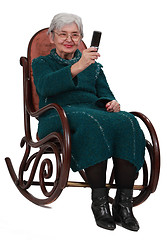 Image showing Senior woman taking photos with a phone