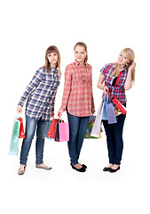 Image showing Three girls with colorful shopping bags