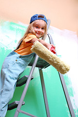 Image showing child on ladder with a roller