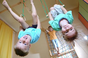 Image showing children hanging on gymnastic rings