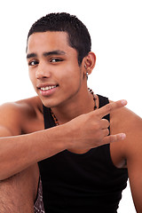 Image showing Young latin man with thumbs raised as cool signal