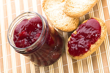 Image showing Breakfast of cherry jam on toast