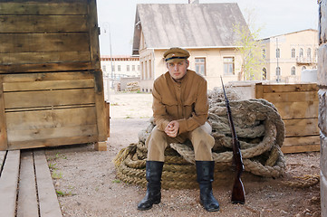 Image showing Retro style picture with soldier sitting on the rope