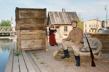 Image showing Lady and soldier with  gun in retro style picture