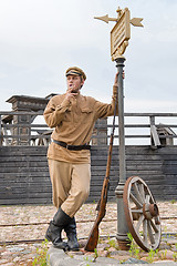 Image showing Retro style picture with soldier at tram stop.