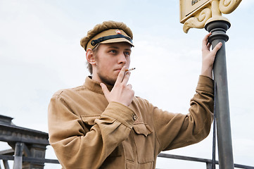 Image showing Retro style picture with smoking soldier.