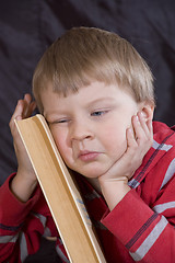 Image showing child and book