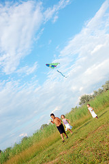 Image showing children running with a kite