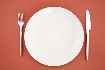 Image showing Knife, white plate and fork