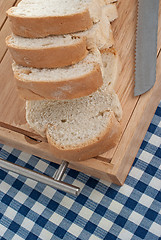 Image showing Slices of bread on top of wooden board