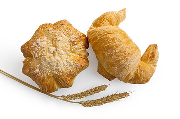 Image showing Croissant and bread roll with stems of wheat