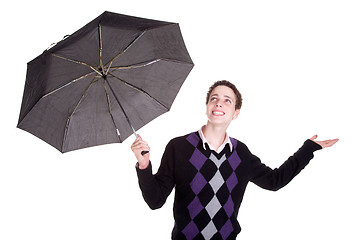 Image showing Young boy bypassing the umbrella