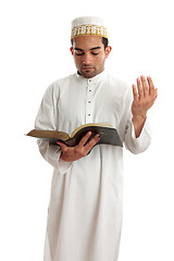 Image showing Teacher or Preacher reading from a book