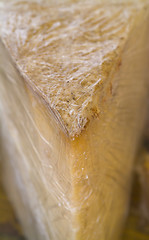 Image showing Cheese wedge in clingfilm