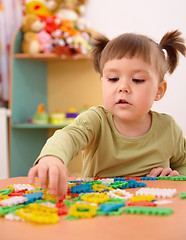 Image showing Little girl play with building bricks in preschool