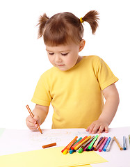 Image showing Cute child draws with felt-tip pens