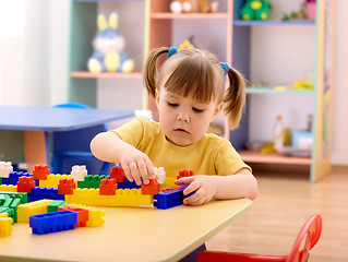 Image showing Little girl play with building bricks in preschool