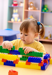 Image showing Little girl play with building bricks in preschool