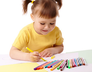 Image showing Cute child draws with felt-tip pens