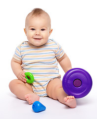 Image showing Little boy play with toys