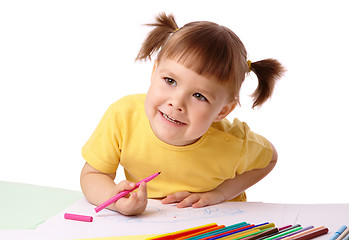 Image showing Cute child draws with felt-tip pens