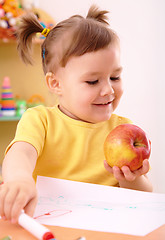 Image showing Little girl with apple