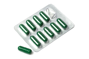 Image showing Green capsules packed in blister