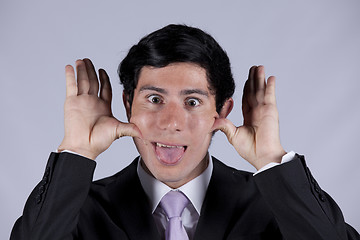 Image showing Young businessman with a funny face